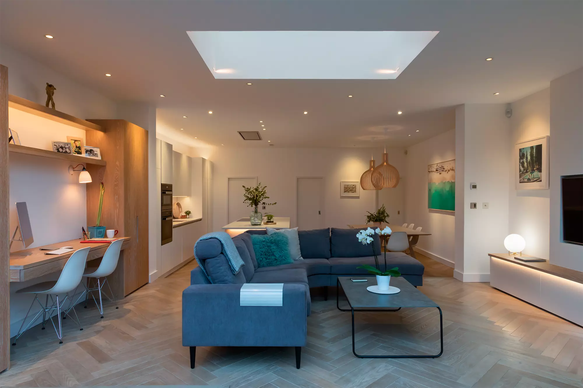 A modern well lit living room featuring multiple lighting sources including recessed ceiling lights a large skylight - 50+ Inspiring Living Room Lighting Ideas for February 2025 - Vorlane