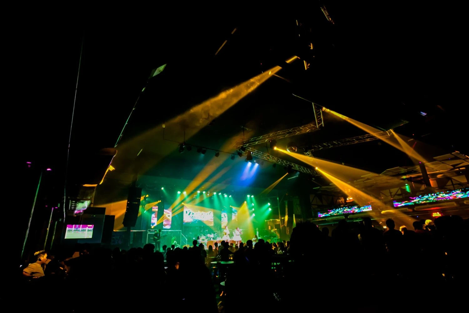 A vibrant concert scene featuring dazzling lights and an enthusiastic audience immersed in the performance - Best Concert Stage Set Designs That Will Blow Your Mind - Vorlane
