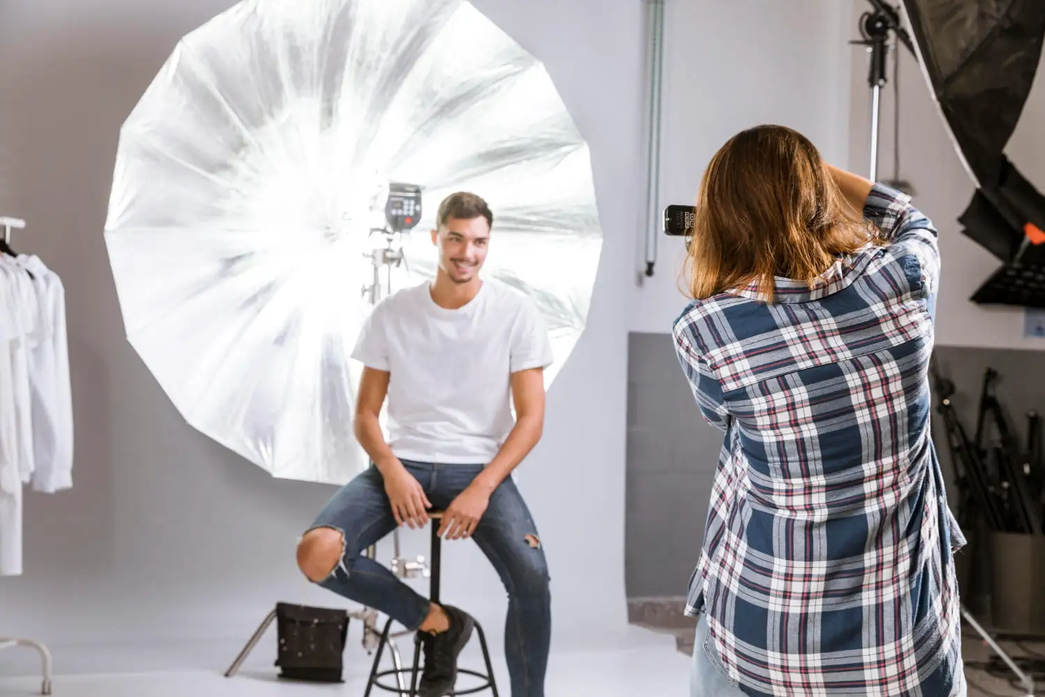 Front Lighting Photography Image of a man and woman getting photographed in a studio - Front Lighting Photography: How to Shoot With Front Light - Vorlane