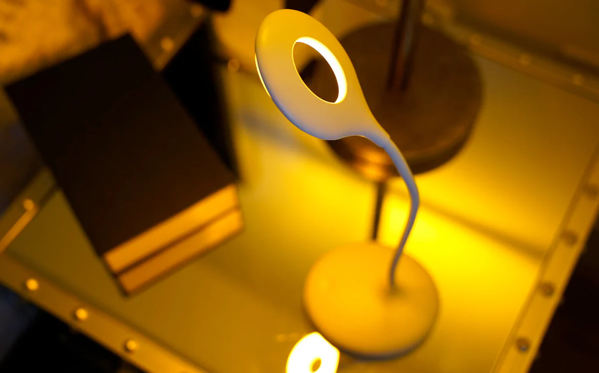 Warm yellow LED light on a study desk providing optimal illumination for reading and studying - What are the Best LED Colors for Reading and Studying? - Vorlane